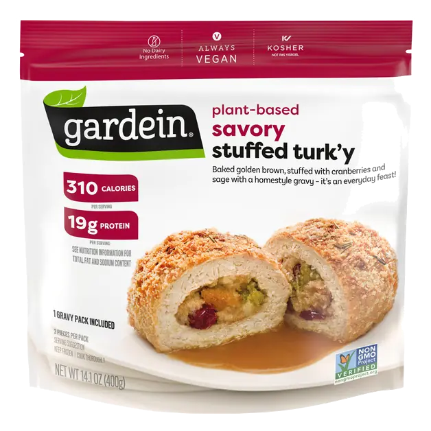 Savory Plant-Based Stuffed Turk'y Baked Golden Brown, Stuffed with Cranberries and Sage with a Homestyle Gravy